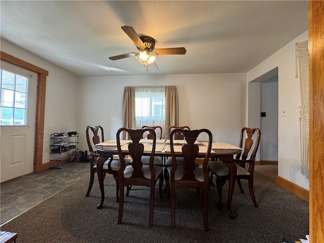 203 10th, St, PA 15963 - dining space with healthy amount of natural light, ceiling fan, and dark colored carpet