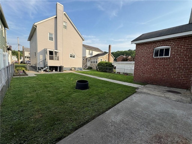 203 10th, St, PA 15963 - view of property exterior featuring a fenced backyard and a chimney