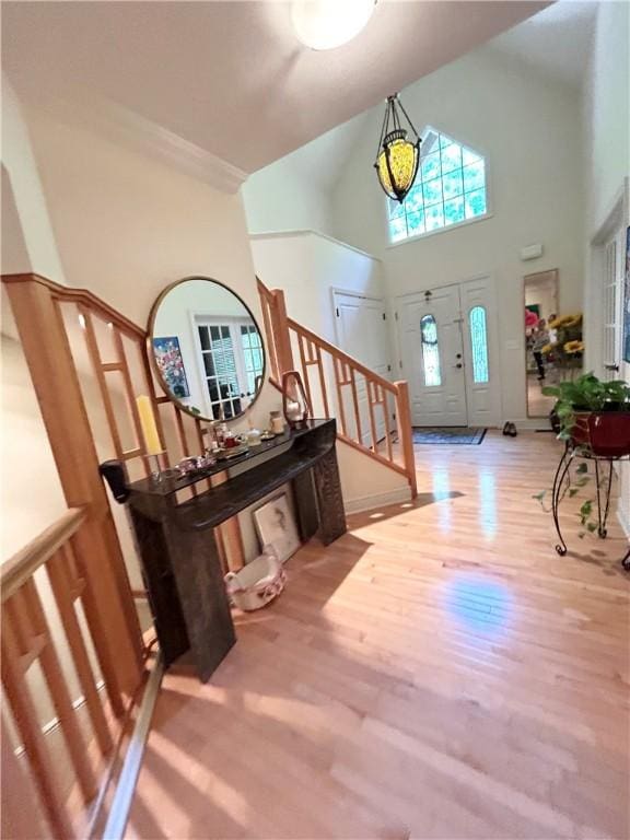 518 Farndale Rd, Ohara, PA 15238 - foyer featuring a towering ceiling, stairway, and wood finished floors