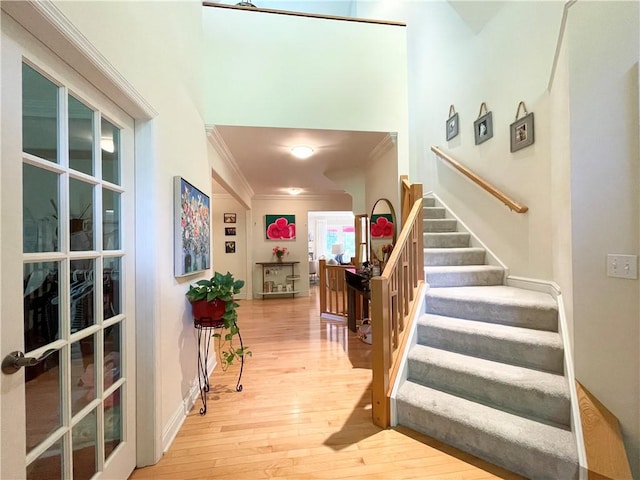 518 Farndale Rd, Ohara, PA 15238 - stairs featuring crown molding and hardwood / wood-style flooring