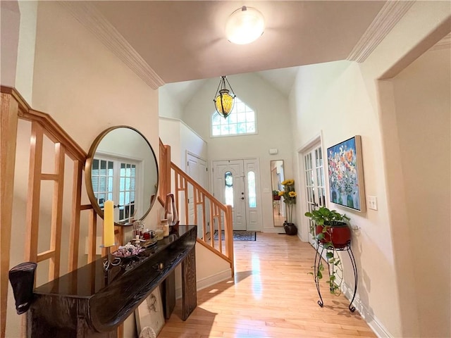 518 Farndale Rd, Ohara, PA 15238 - foyer featuring stairs, light wood finished floors, a towering ceiling, and ornamental molding