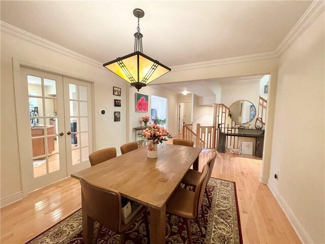 518 Farndale Rd, Ohara, PA 15238 - dining area with light wood-style floors, french doors, ornamental molding, and stairs