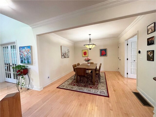 518 Farndale Rd, Ohara, PA 15238 - dining area with light wood-style floors, ornamental molding, and french doors