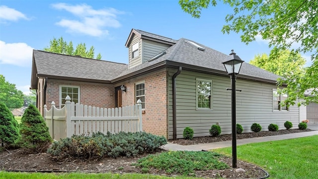 103 Cambridge Ct, Springdale Twp, PA 15049 - view of property exterior with brick siding, a shingled roof, and an attached garage