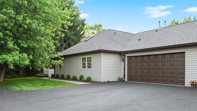 103 Cambridge Ct, Springdale Twp, PA 15049 - view of side of home with a garage, roof with shingles, and asphalt driveway