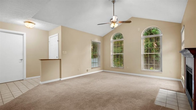 103 Cambridge Ct, Springdale Twp, PA 15049 - unfurnished living room featuring a fireplace with flush hearth, ceiling fan, carpet, lofted ceiling, and tile patterned flooring