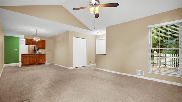 103 Cambridge Ct, Springdale Twp, PA 15049 - unfurnished living room with light carpet, a ceiling fan, and vaulted ceiling