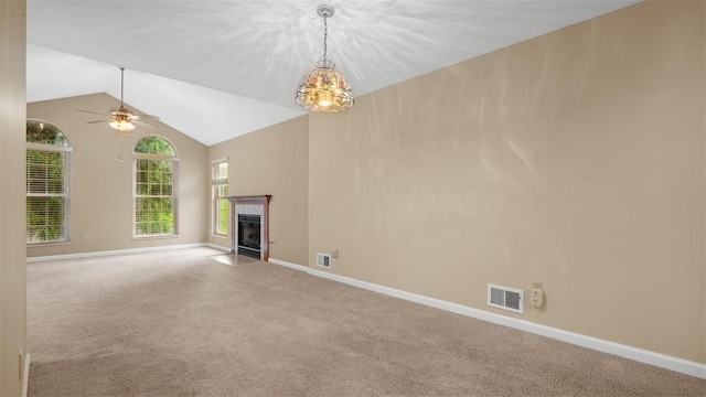 103 Cambridge Ct, Springdale Twp, PA 15049 - unfurnished living room featuring carpet flooring, a tile fireplace, lofted ceiling, and a ceiling fan
