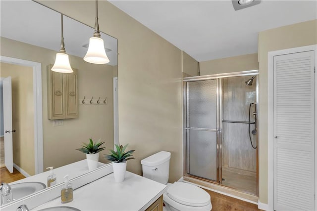 425 Ridge Rd, Hempfield Twp Wml, PA 15601 - bathroom with a closet, a shower stall, vanity, and wood finished floors