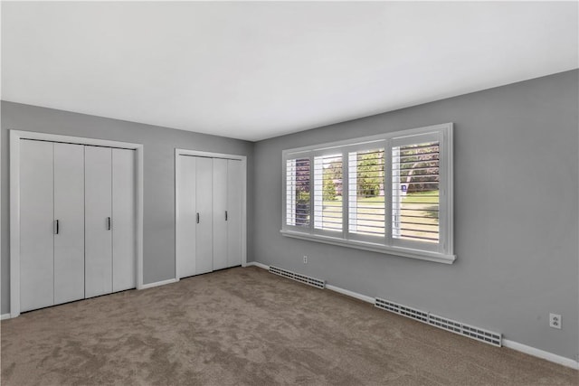 425 Ridge Rd, Hempfield Twp Wml, PA 15601 - unfurnished bedroom with multiple closets and carpet floors
