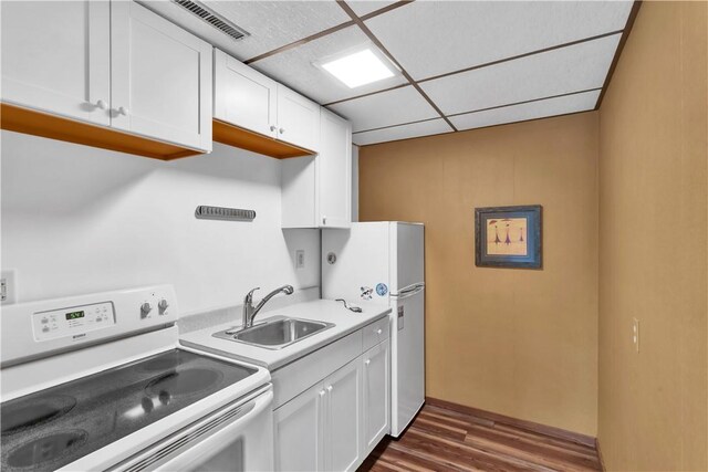 425 Ridge Rd, Hempfield Twp Wml, PA 15601 - kitchen featuring white appliances, dark wood-style flooring, white cabinetry, and light countertops
