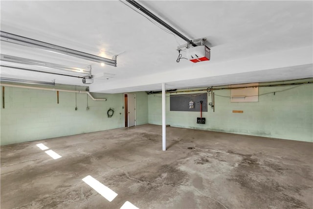 425 Ridge Rd, Hempfield Twp Wml, PA 15601 - garage with a garage door opener and concrete block wall