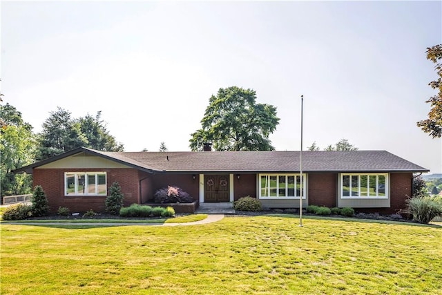 425 Ridge Rd, Hempfield Twp Wml, PA 15601 - ranch-style house with a front lawn and brick siding