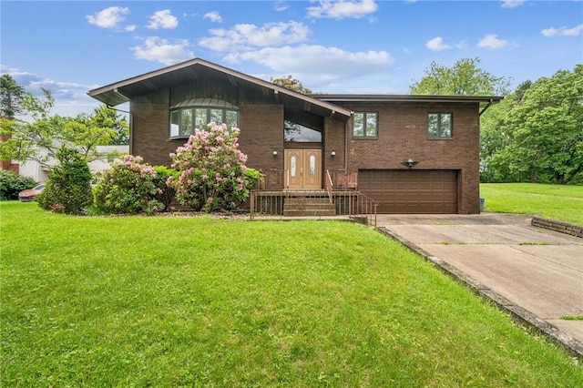 215-217 Fairlawn Dr, Monroeville, PA 15146 - view of front facade featuring an attached garage, concrete driveway, brick siding, a front yard, and french doors