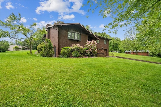 215-217 Fairlawn Dr, Monroeville, PA 15146 - view of side of home featuring a lawn and an attached garage