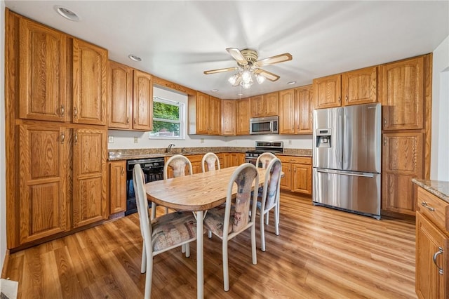 215-217 Fairlawn Dr, Monroeville, PA 15146 - kitchen with appliances with stainless steel finishes, ceiling fan, light wood-style floors, brown cabinets, and recessed lighting