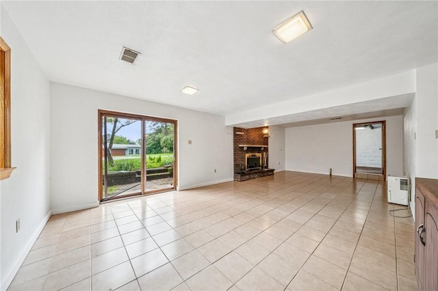 215-217 Fairlawn Dr, Monroeville, PA 15146 - unfurnished living room featuring a brick fireplace and light tile patterned flooring