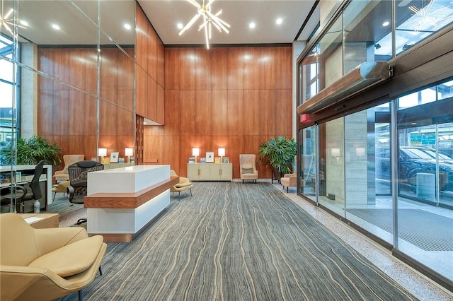 320 Fort Duquesne Blvd Unit 26N, Downtown Pgh, PA 15222 - lobby with a towering ceiling, wood walls, and recessed lighting