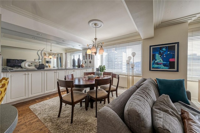 320 Fort Duquesne Blvd Unit 26N, Downtown Pgh, PA 15222 - dining space with wood finished floors, ornamental molding, a chandelier, and a raised ceiling