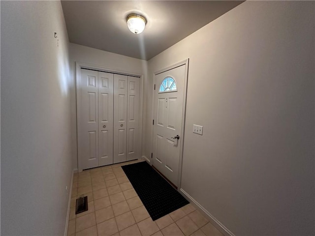 207 Village Ct, South Strabane, PA 15301 - entrance foyer featuring light tile patterned flooring and baseboards