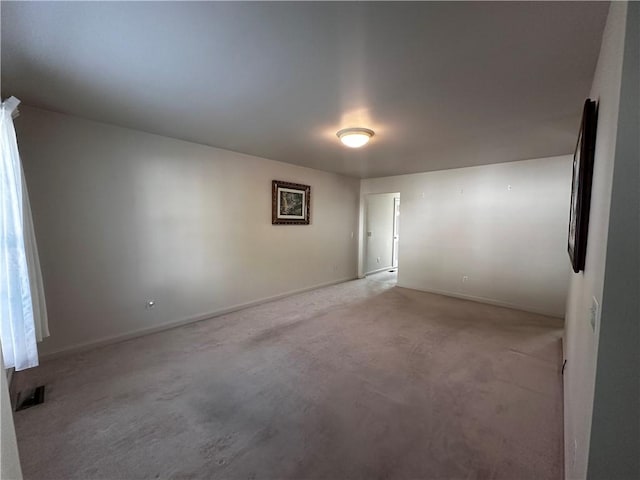 207 Village Ct, South Strabane, PA 15301 - spare room featuring baseboards and light carpet