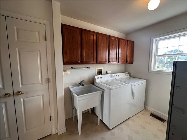 207 Village Ct, South Strabane, PA 15301 - laundry area featuring separate washer and dryer, cabinet space, and light floors