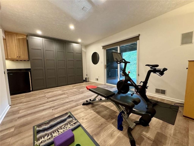 71 Waterfront Dr, Washingtons Landing, PA 15222 - workout room featuring a textured ceiling, light wood finished floors, and recessed lighting