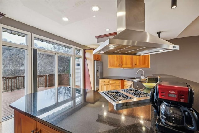 71 Waterfront Dr, Washingtons Landing, PA 15222 - kitchen featuring island exhaust hood, stainless steel fridge, a peninsula, recessed lighting, and dark stone countertops