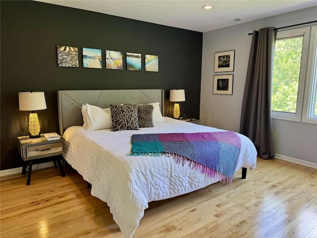 71 Waterfront Dr, Washingtons Landing, PA 15222 - bedroom with multiple windows, light wood-type flooring, and recessed lighting