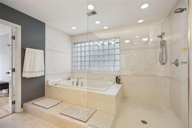 71 Waterfront Dr, Washingtons Landing, PA 15222 - bathroom featuring tile patterned floors, a garden tub, a tile shower, and recessed lighting