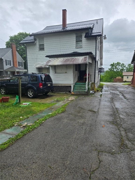 615 Morgantown Rd, South Union Twp, PA 15401 - rear view of property featuring a chimney and a metal roof