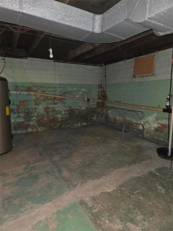 615 Morgantown Rd, South Union Twp, PA 15401 - unfinished below grade area featuring water heater and concrete block wall