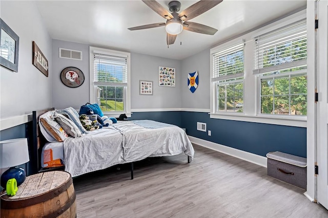 401 Stanford Ave, Ross Twp, PA 15229 - bedroom featuring multiple windows, wood finished floors, and ceiling fan