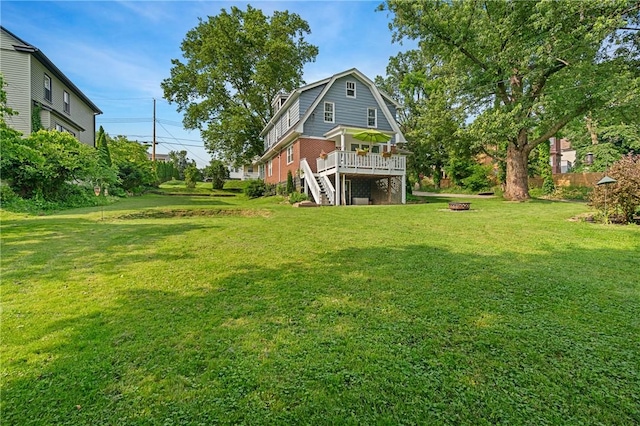 401 Stanford Ave, Ross Twp, PA 15229 - view of green lawn with a wooden deck, stairway, and an outdoor fire pit
