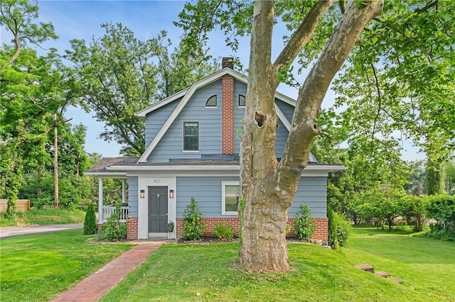 401 Stanford Ave, Ross Twp, PA 15229 - dutch colonial with a front lawn, a chimney, brick siding, and a shingled roof