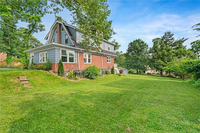 401 Stanford Ave, Ross Twp, PA 15229 - back of house with brick siding, a lawn, and a gambrel roof