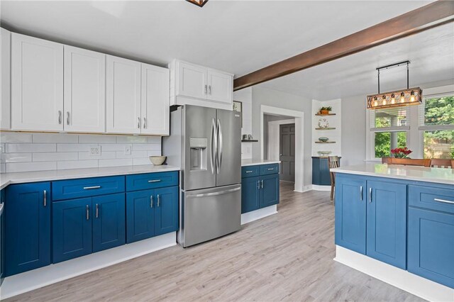 401 Stanford Ave, Ross Twp, PA 15229 - kitchen featuring stainless steel fridge with ice dispenser, blue cabinets, light wood-style flooring, light countertops, and tasteful backsplash