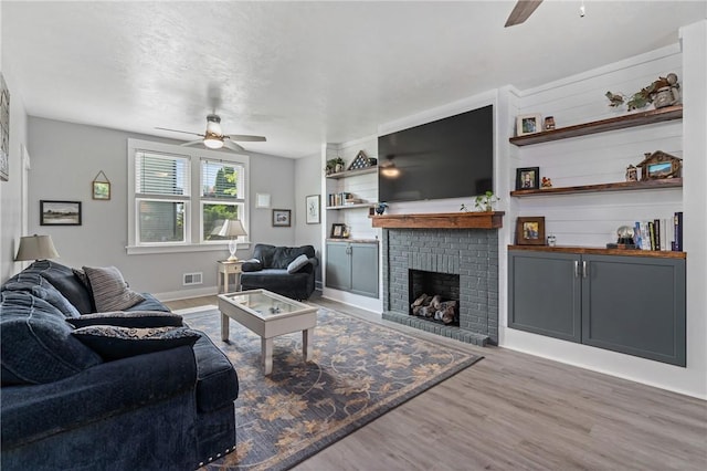 401 Stanford Ave, Ross Twp, PA 15229 - living room with ceiling fan, wood finished floors, and a brick fireplace
