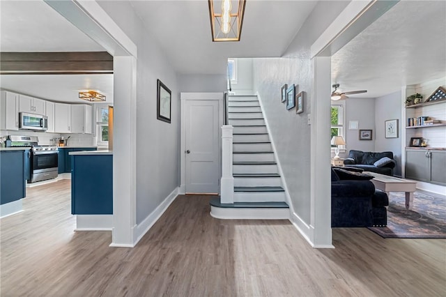 401 Stanford Ave, Ross Twp, PA 15229 - foyer entrance featuring light wood finished floors, stairway, and a ceiling fan