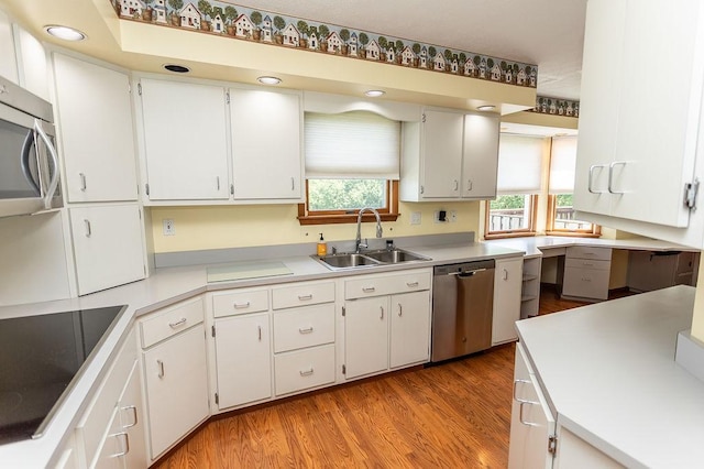 408 Victor Dr, South Union Twp, PA 15401 - kitchen with stainless steel appliances, white cabinetry, light wood-style flooring, light countertops, and recessed lighting