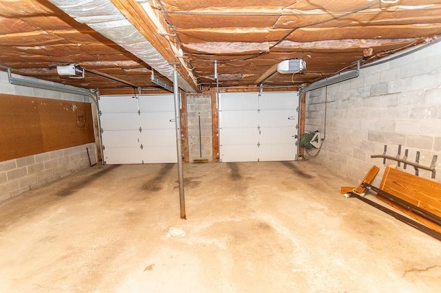 408 Victor Dr, South Union Twp, PA 15401 - garage featuring concrete block wall and a garage door opener