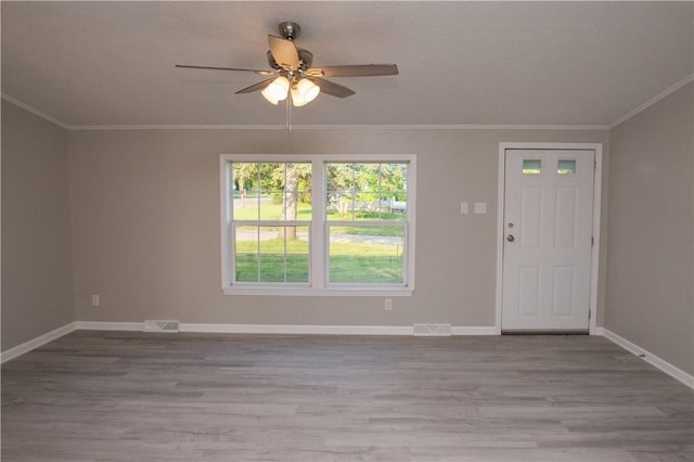 824 Emerson Ave, Farrell, PA 16121 - foyer featuring a ceiling fan, wood finished floors, and crown molding