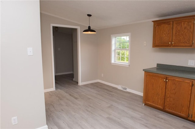 824 Emerson Ave, Farrell, PA 16121 - unfurnished dining area featuring light wood-style floors and ornamental molding