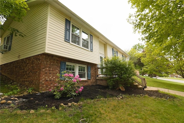 248 Laddie Dr, Canton Twp, PA 15301 - view of side of home featuring brick siding, a yard, and cooling unit