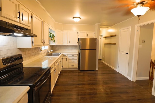 248 Laddie Dr, Canton Twp, PA 15301 - kitchen featuring black / electric stove, freestanding refrigerator, under cabinet range hood, light countertops, and dark wood-type flooring