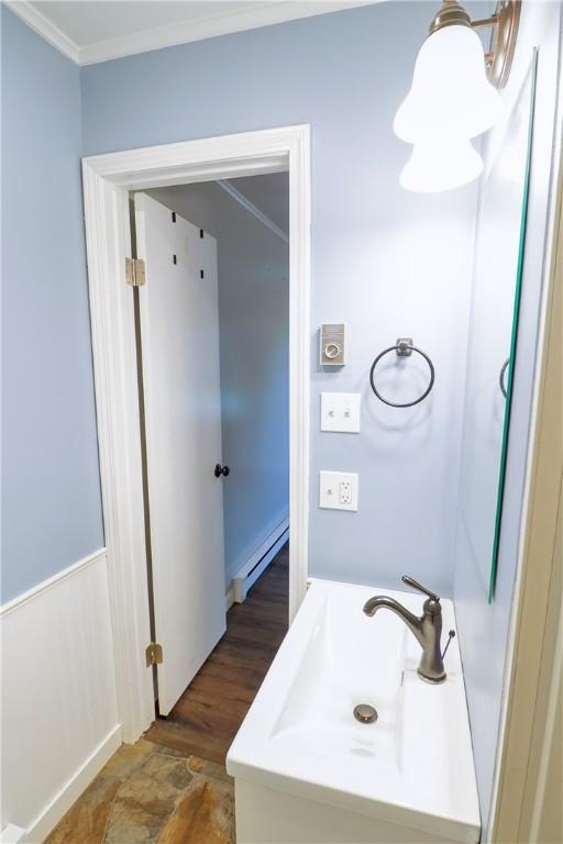 248 Laddie Dr, Canton Twp, PA 15301 - bathroom with baseboard heating and ornamental molding