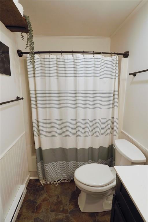 248 Laddie Dr, Canton Twp, PA 15301 - bathroom featuring baseboard heating, vanity, ornamental molding, stone finish flooring, and a shower with curtain