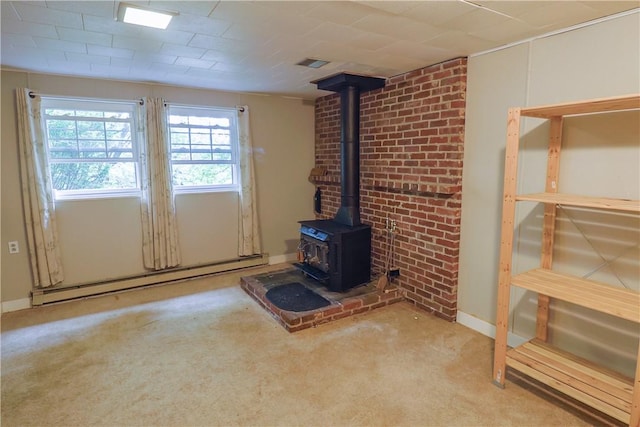 248 Laddie Dr, Canton Twp, PA 15301 - unfurnished living room with a baseboard heating unit, a wood stove, and carpet