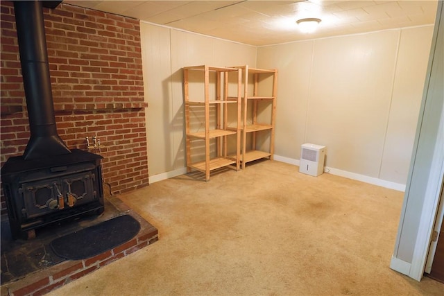 248 Laddie Dr, Canton Twp, PA 15301 - unfurnished living room featuring a wood stove and light colored carpet