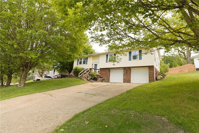 248 Laddie Dr, Canton Twp, PA 15301 - bi-level home featuring an attached garage, brick siding, and a front lawn